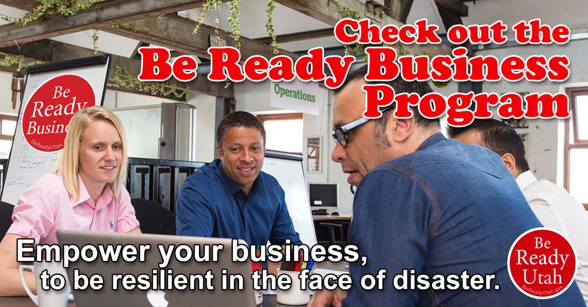 This image is of a team at a business sitting around a table discussing plans for business preparedness